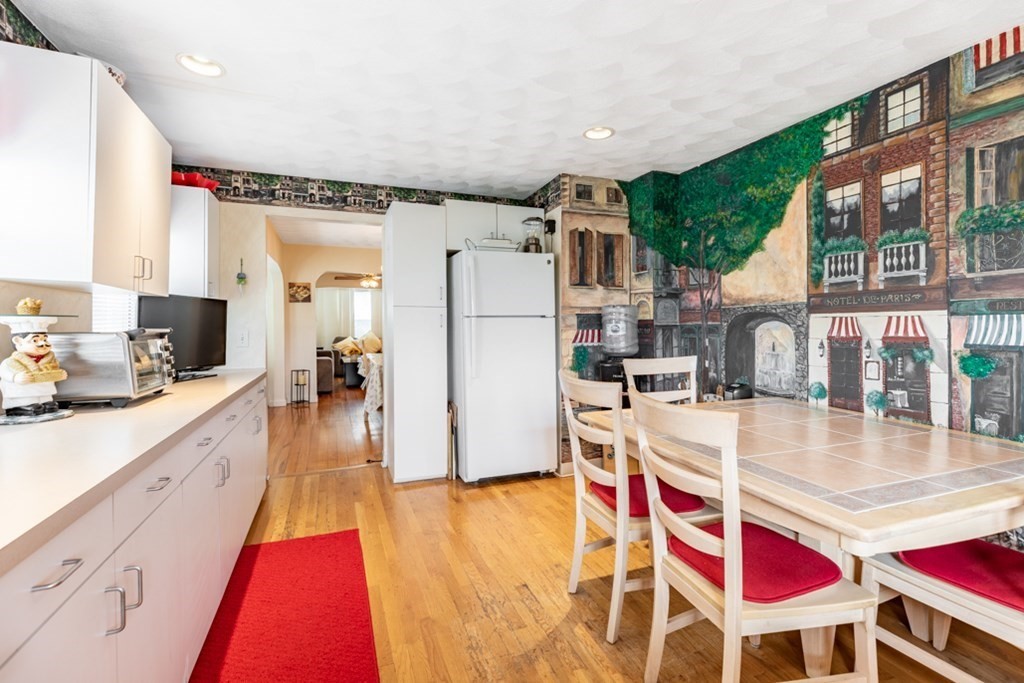 272 River Road Winthrop, MA 02152 - Photo 28 of 42 a very nice looking open kitchen with stainless steel appliances granite countertop a refrigerator and stove