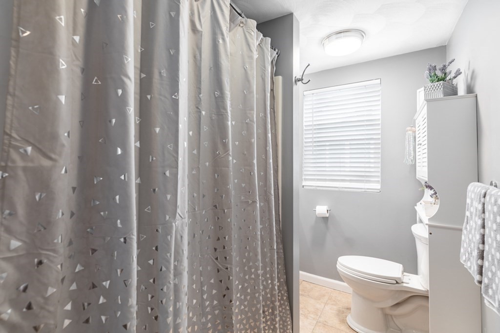 272 River Road Winthrop, MA 02152 - Photo 29 of 42 a white toilet sitting next to a bathroom sink