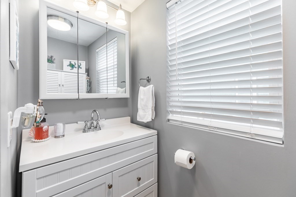 272 River Road Winthrop, MA 02152 - Photo 30 of 42 a bathroom with a sink and a mirror