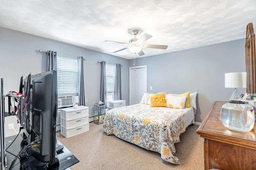 272 River Road Winthrop, MA 02152 - Photo 31 of 42 a bedroom with a bed and a flat tv screen on dresser