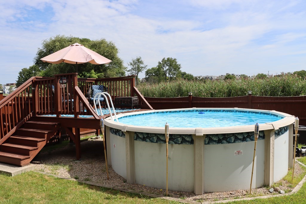 272 River Road Winthrop, MA 02152 - Photo 37 of 42 an aerial view of a table and chairs under an umbrella