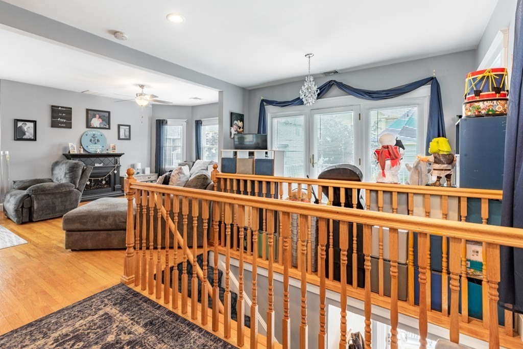 272 River Road Winthrop, MA 02152 - Photo 7 of 42 a bedroom with furniture a flat screen tv and a couch