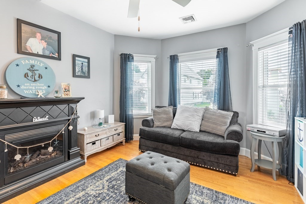 272 River Road Winthrop, MA 02152 - Photo 8 of 42 a living room with furniture and a fireplace