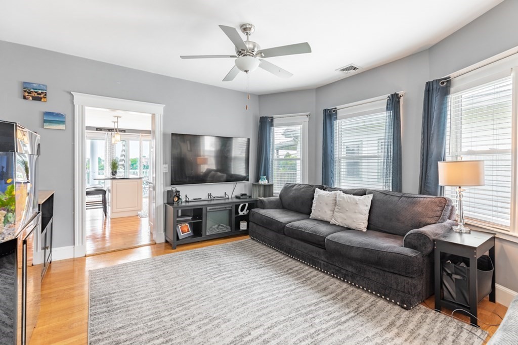272 River Road Winthrop, MA 02152 - Photo 9 of 42 a living room with furniture and a flat screen tv