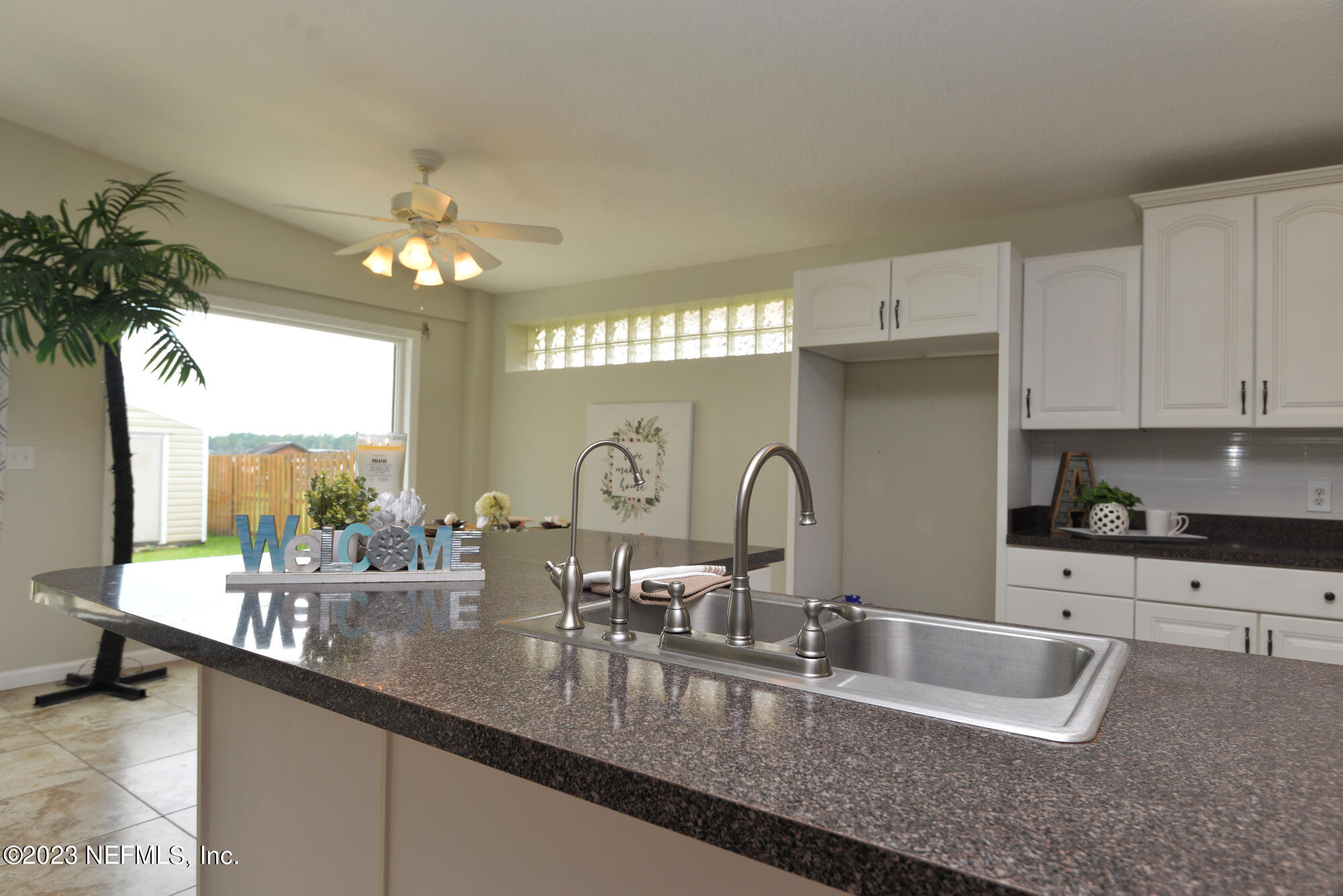 2976 Magnolia Road Orange Park, FL 32065 - Photo 12 of 44 a kitchen with counter top a sink and cabinets