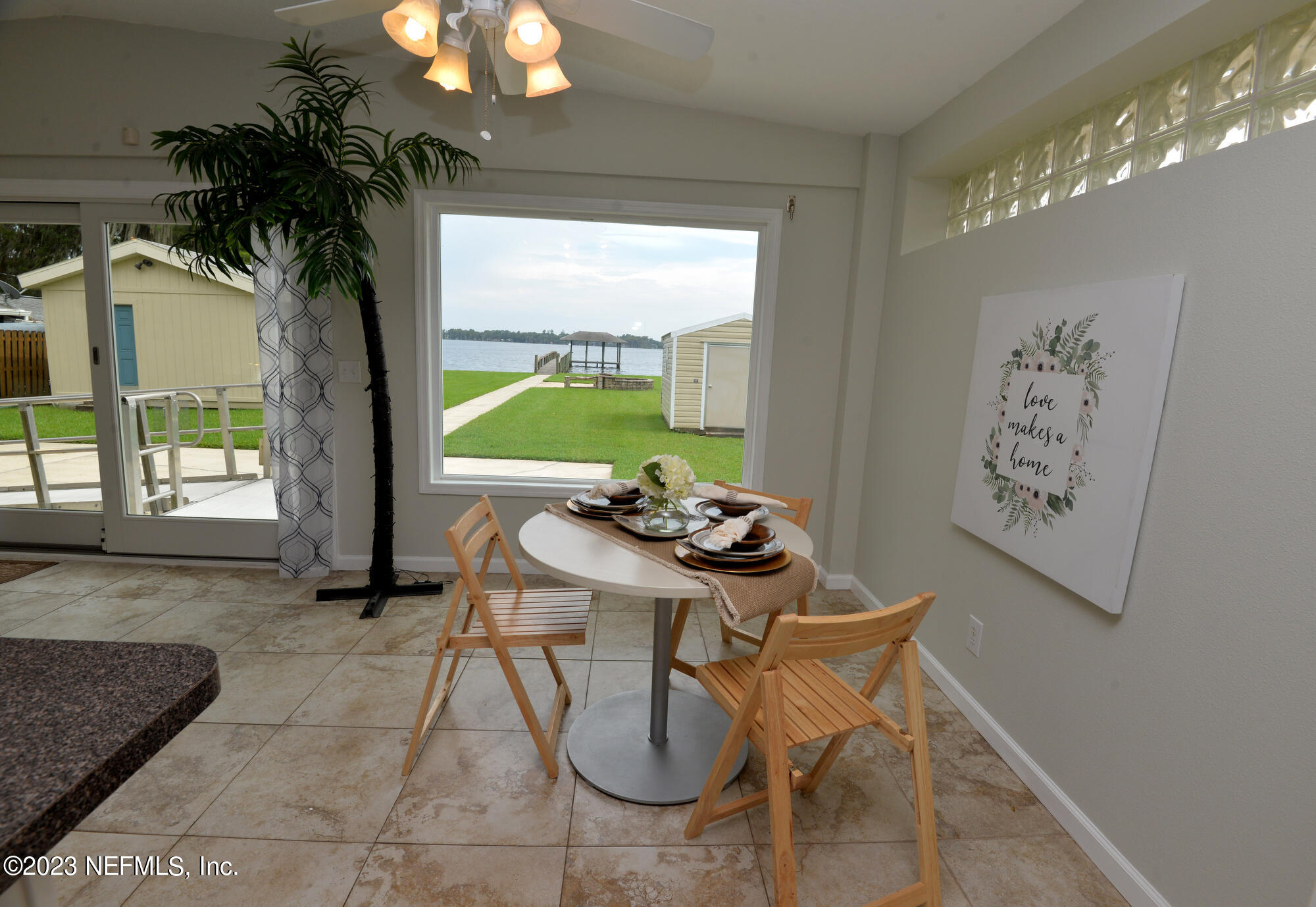2976 Magnolia Road Orange Park, FL 32065 - Photo 15 of 44 a dining room with furniture and a large window