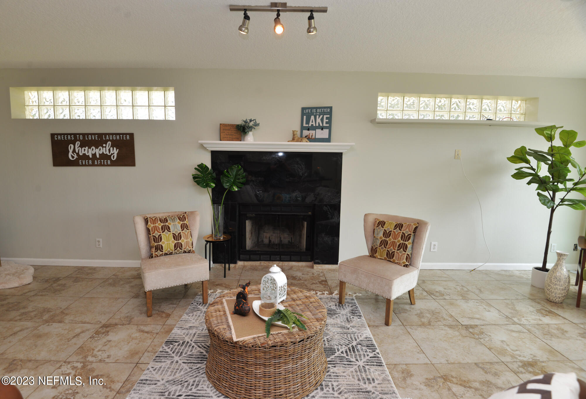 2976 Magnolia Road Orange Park, FL 32065 - Photo 17 of 44 a living room with furniture and a fireplace