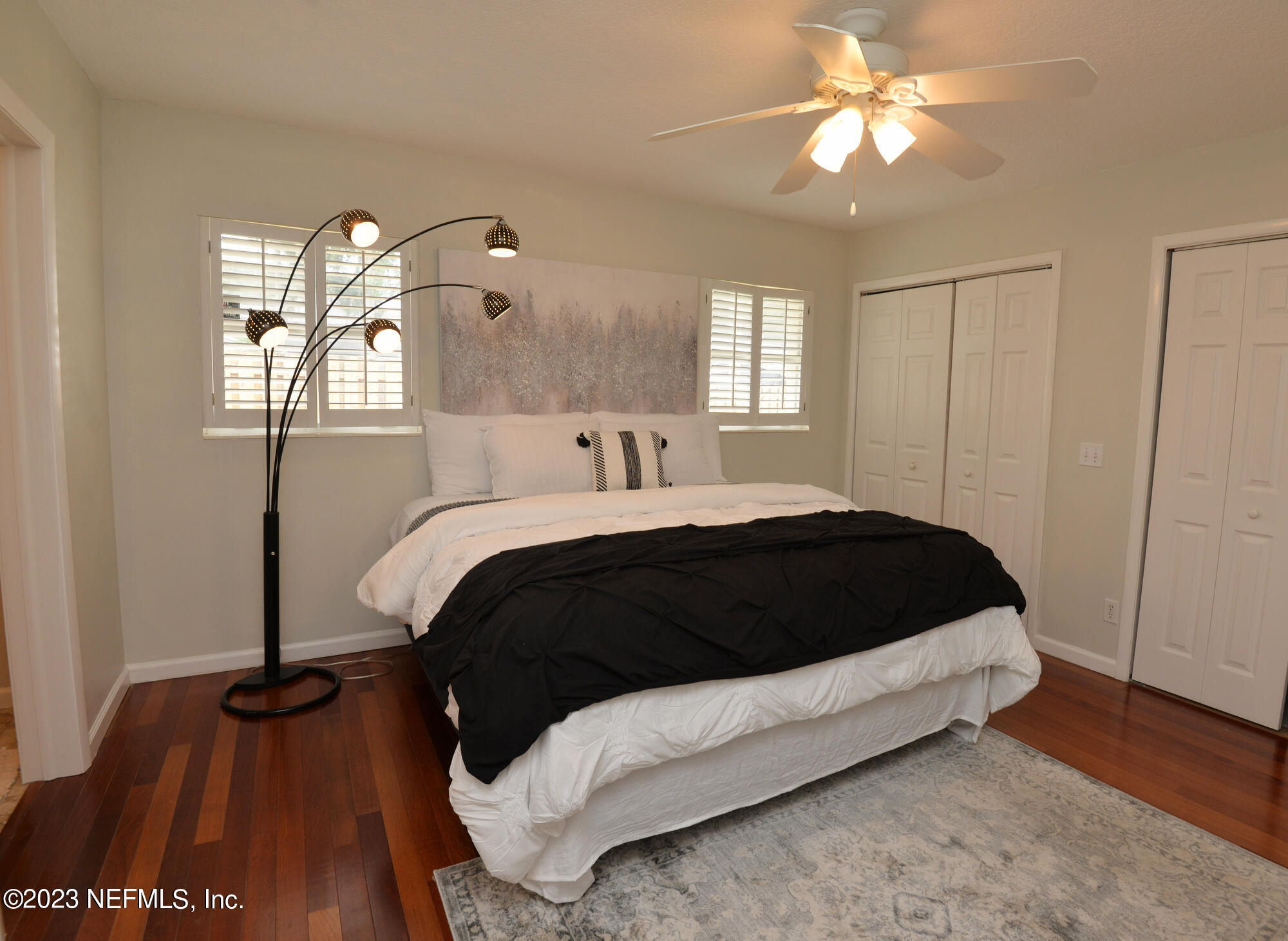 2976 Magnolia Road Orange Park, FL 32065 - Photo 20 of 44 a bedroom with a bed and a chandelier