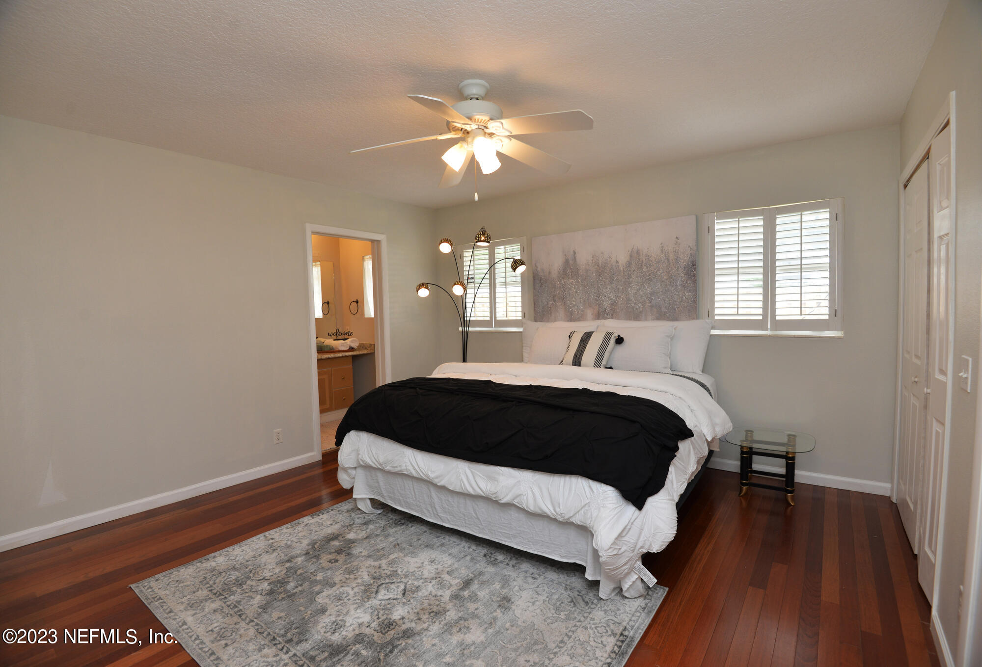2976 Magnolia Road Orange Park, FL 32065 - Photo 21 of 44 a bedroom with a bed and wooden floor