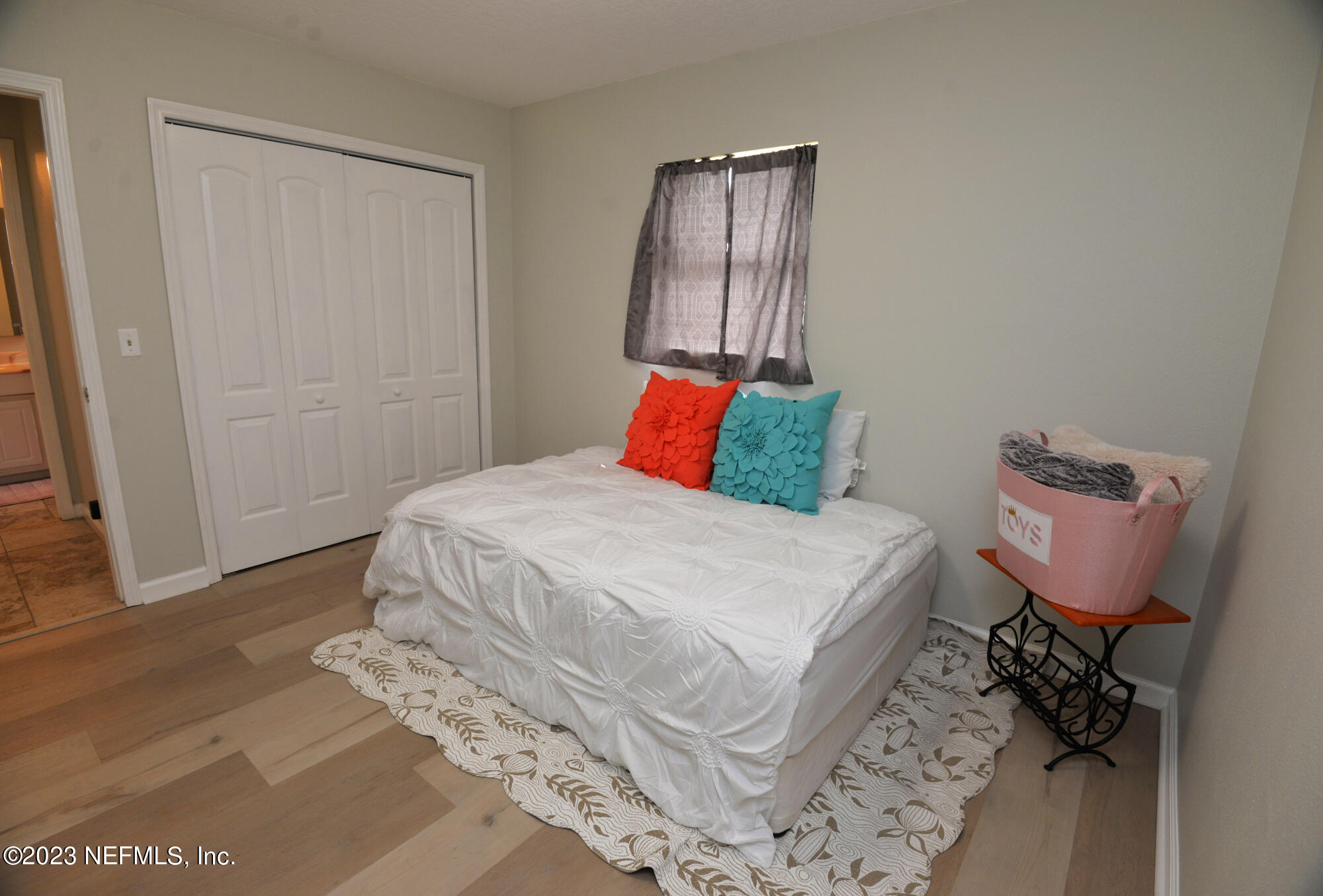 2976 Magnolia Road Orange Park, FL 32065 - Photo 24 of 44 a bedroom with a bed and wooden floor