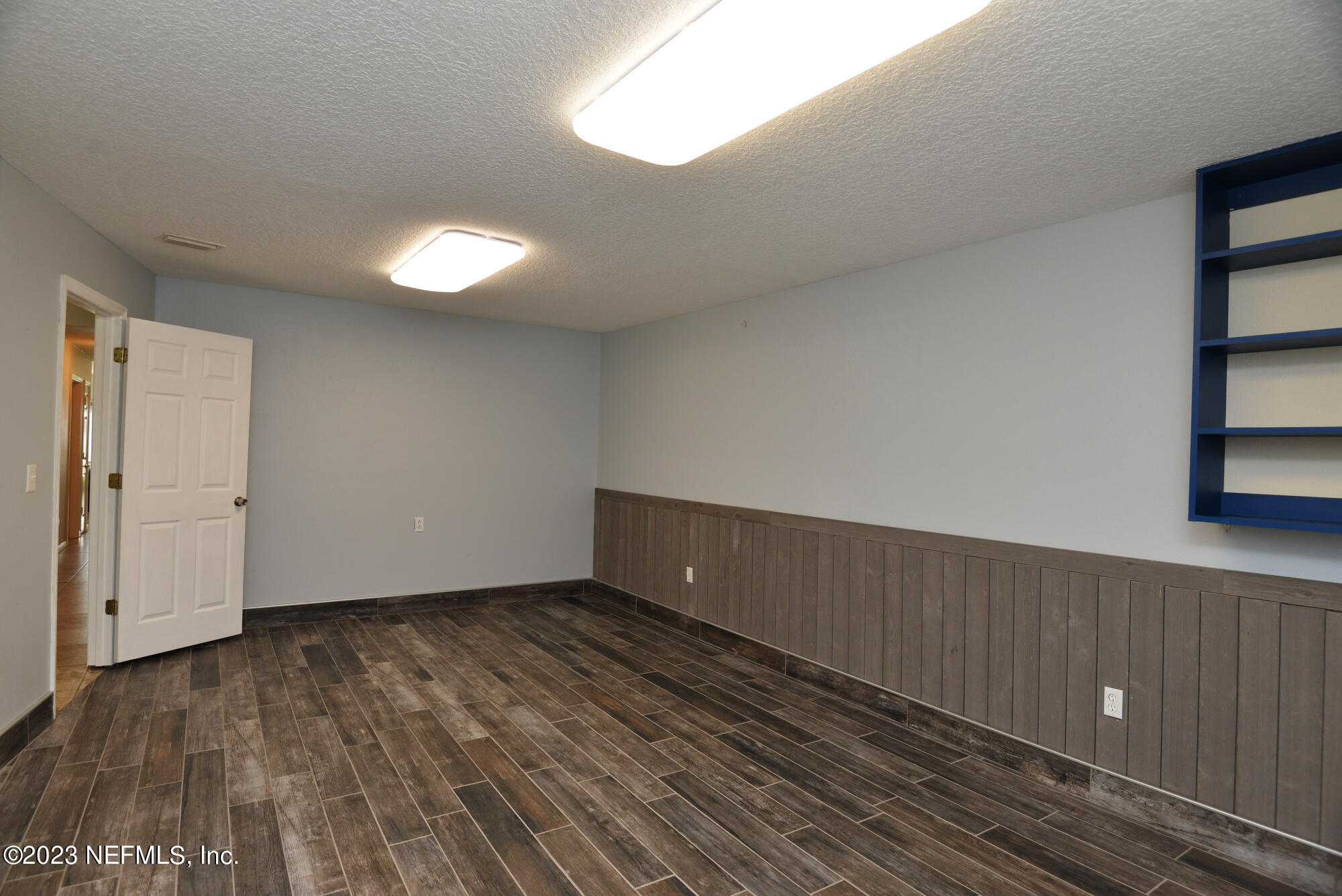 2976 Magnolia Road Orange Park, FL 32065 - Photo 25 of 44 a view of an empty room with wooden floor