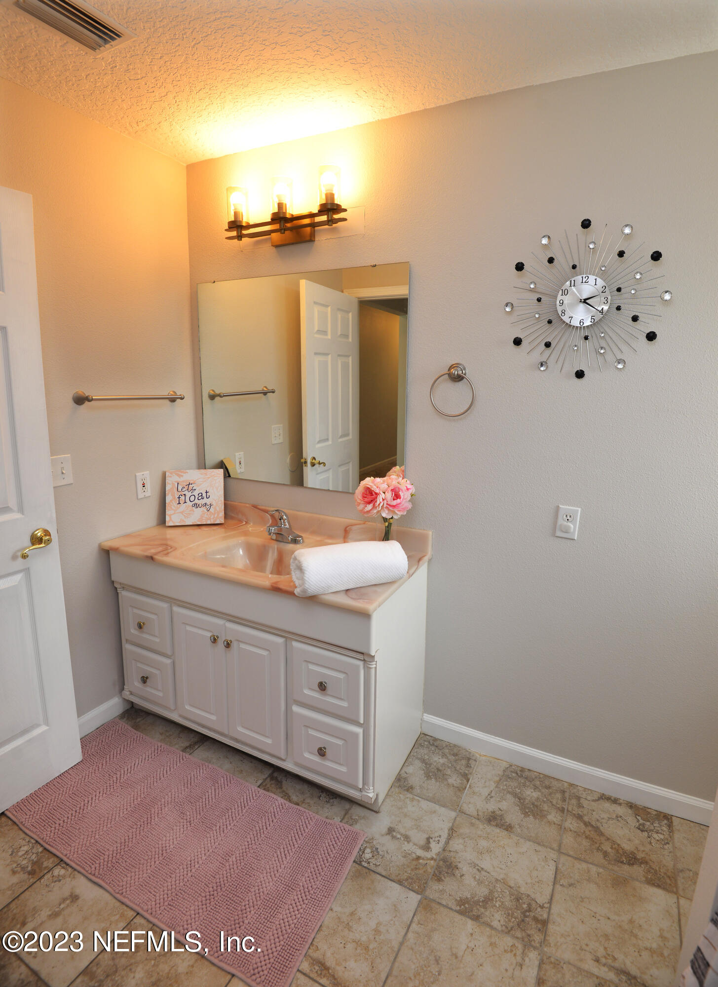 2976 Magnolia Road Orange Park, FL 32065 - Photo 26 of 44 a bathroom with mirror and sink