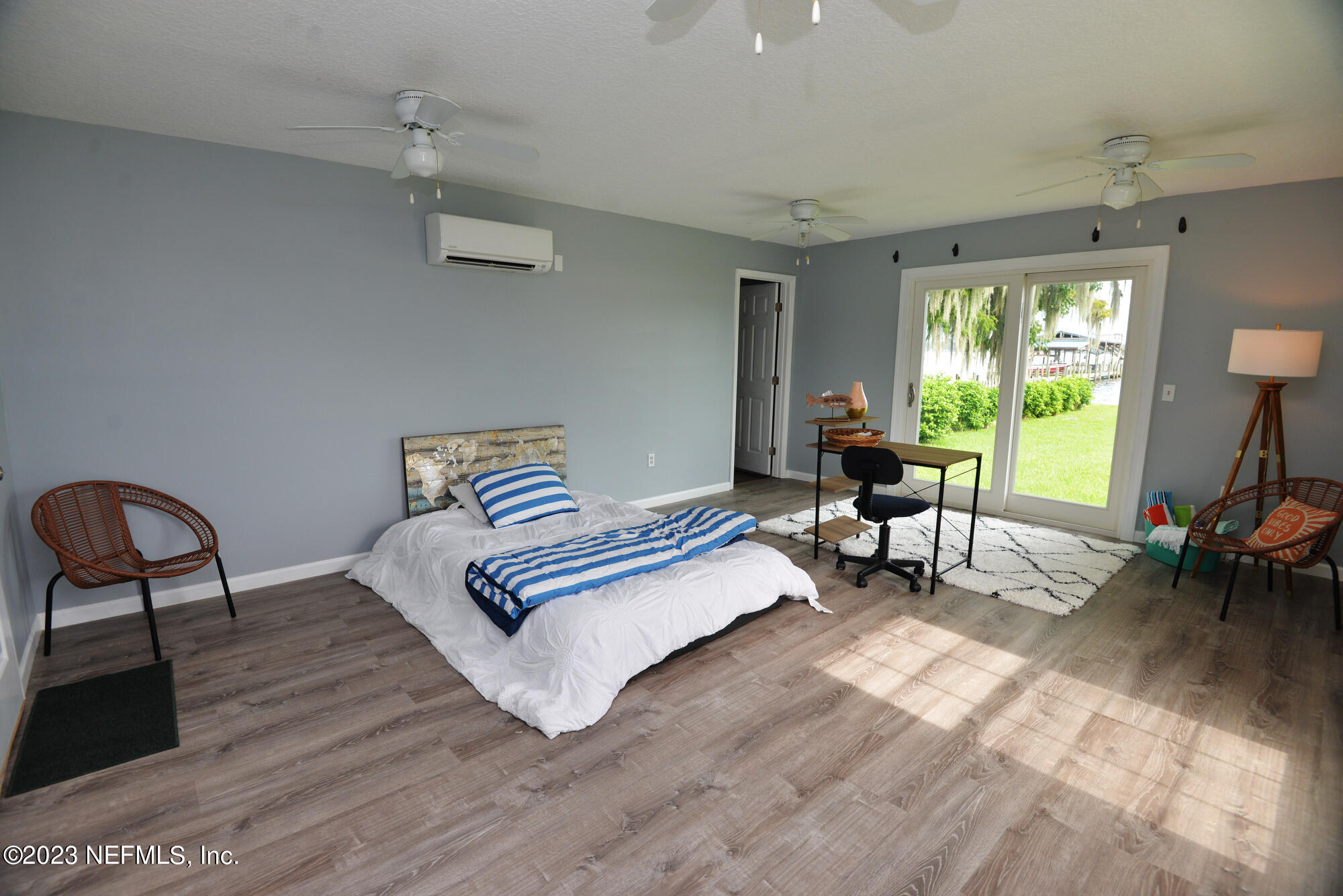 2976 Magnolia Road Orange Park, FL 32065 - Photo 31 of 44 a living room with furniture and a wooden floor