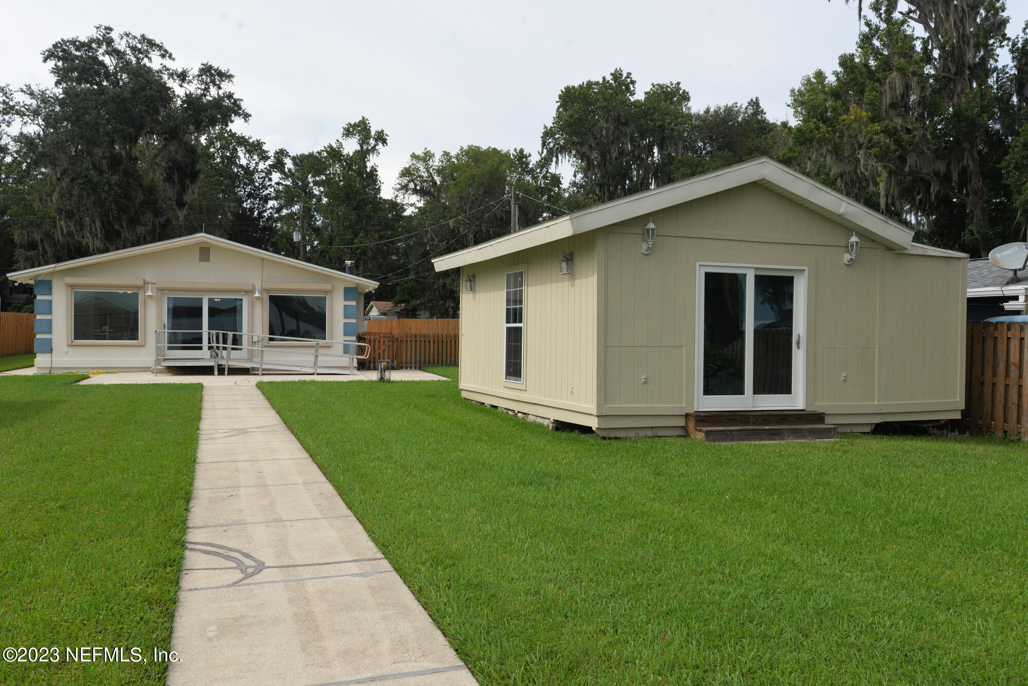 2976 Magnolia Road Orange Park, FL 32065 - Photo 33 of 44 a front view of a house with a yard and garage