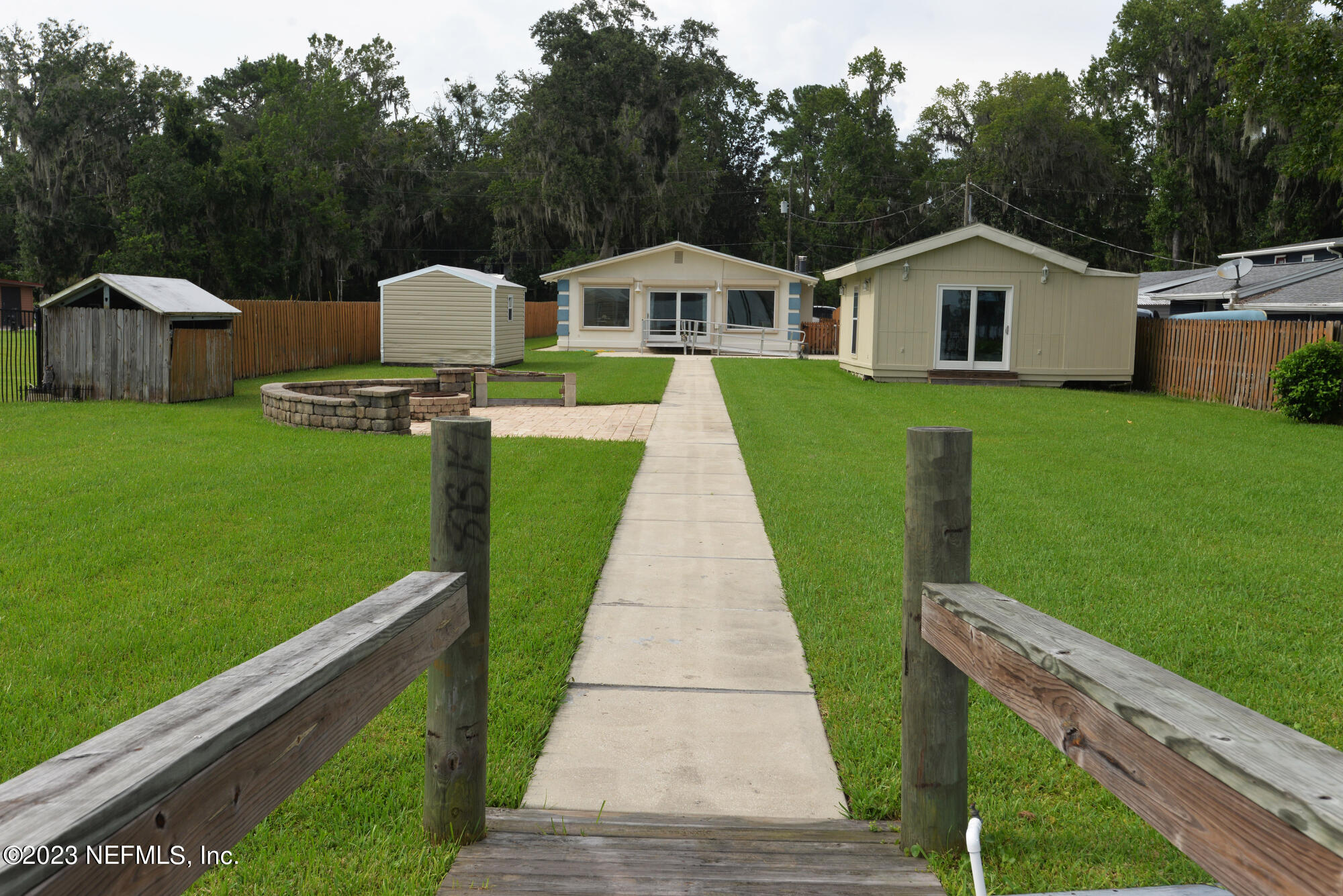 2976 Magnolia Road Orange Park, FL 32065 - Photo 34 of 44 a house view with a garden space