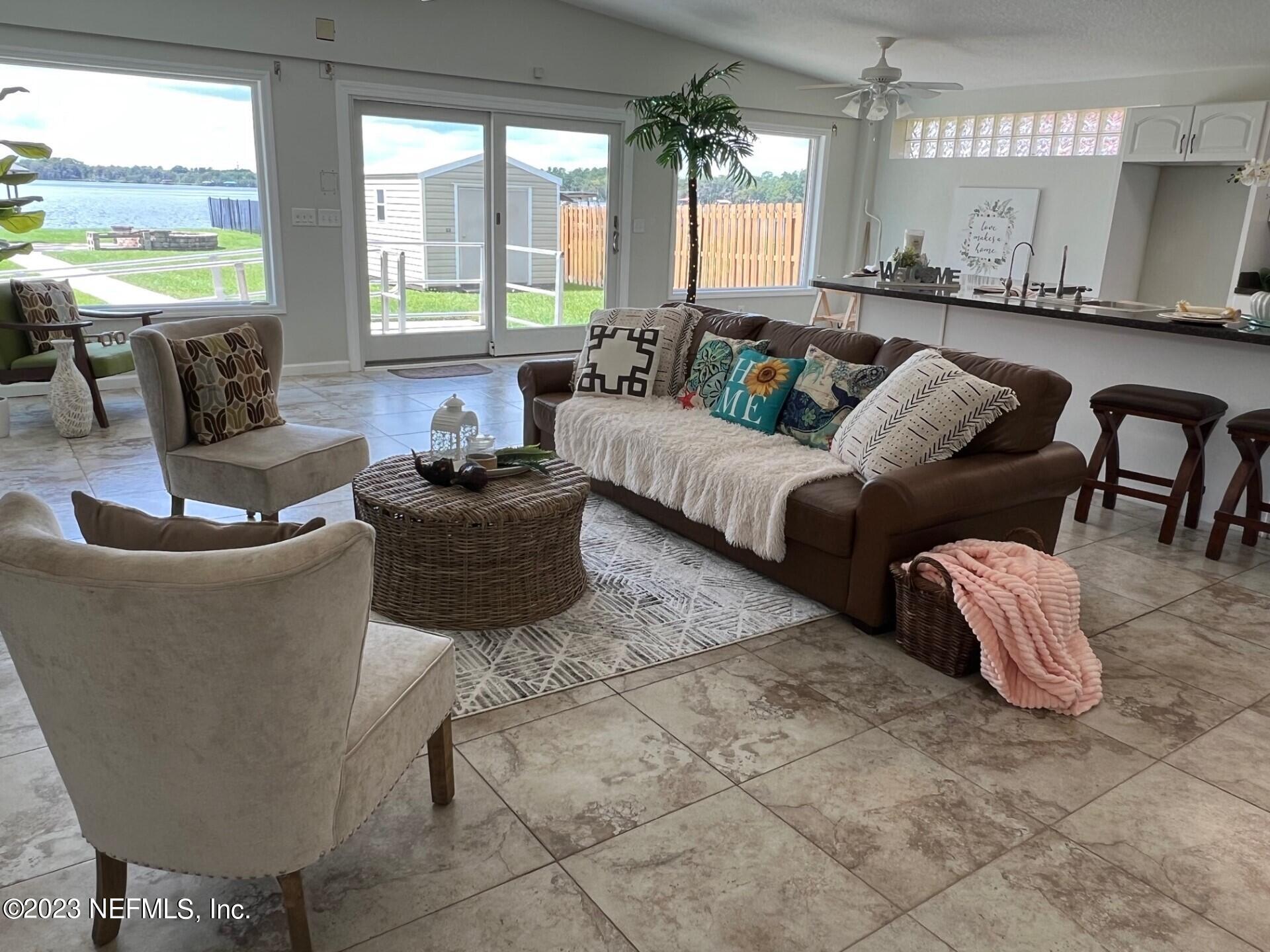 2976 Magnolia Road Orange Park, FL 32065 - Photo 8 of 44 a living room with furniture and a large window