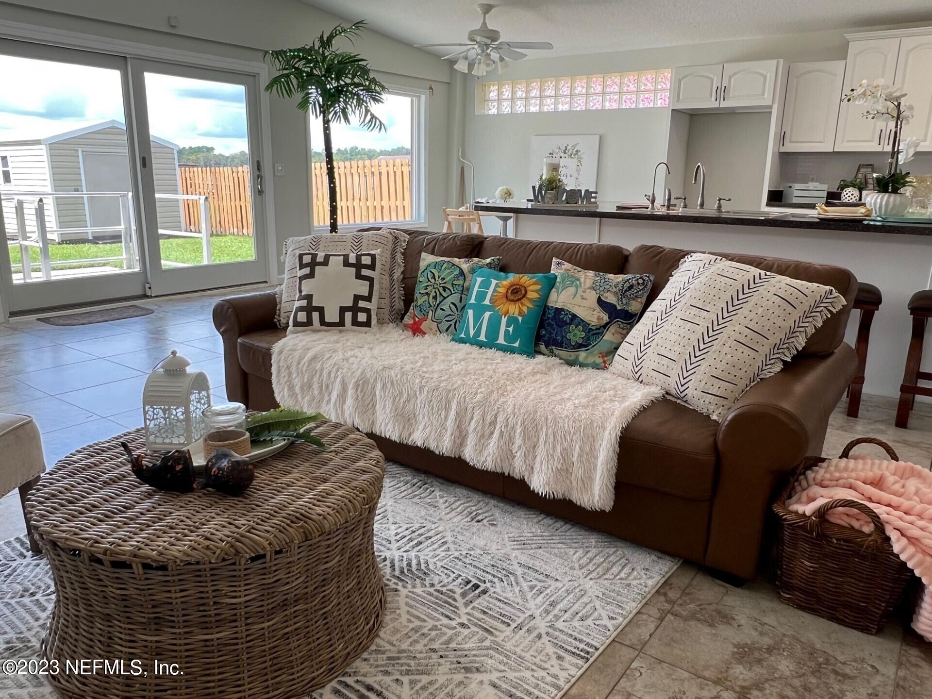 2976 Magnolia Road Orange Park, FL 32065 - Photo 9 of 44 a living room with furniture and a large window