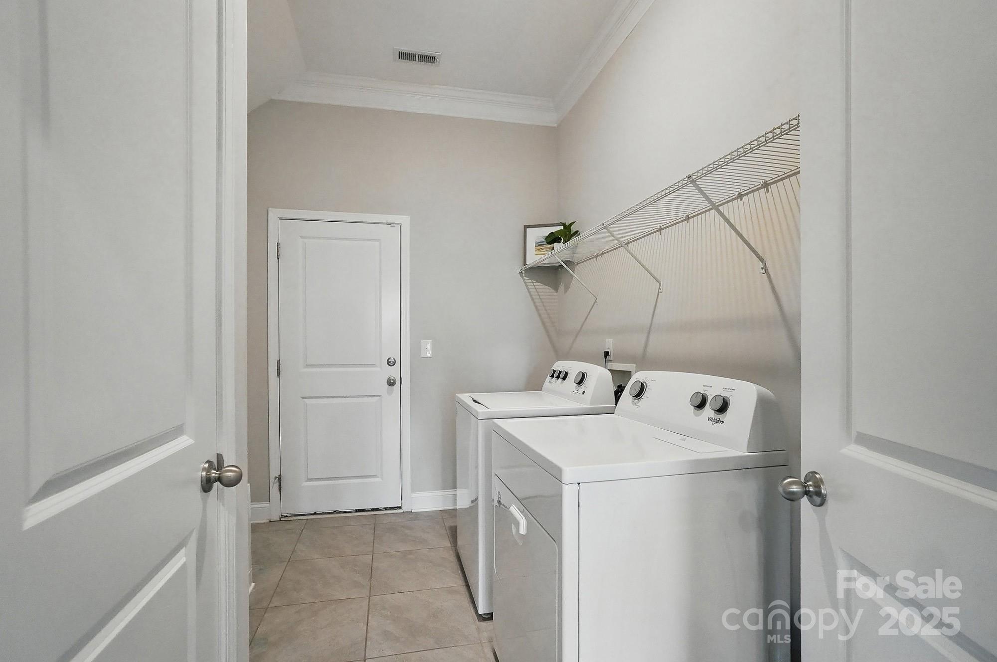 5004 Oakmere Road Waxhaw, NC 28173 - Photo 17 of 48 a utility room with dryer and washer