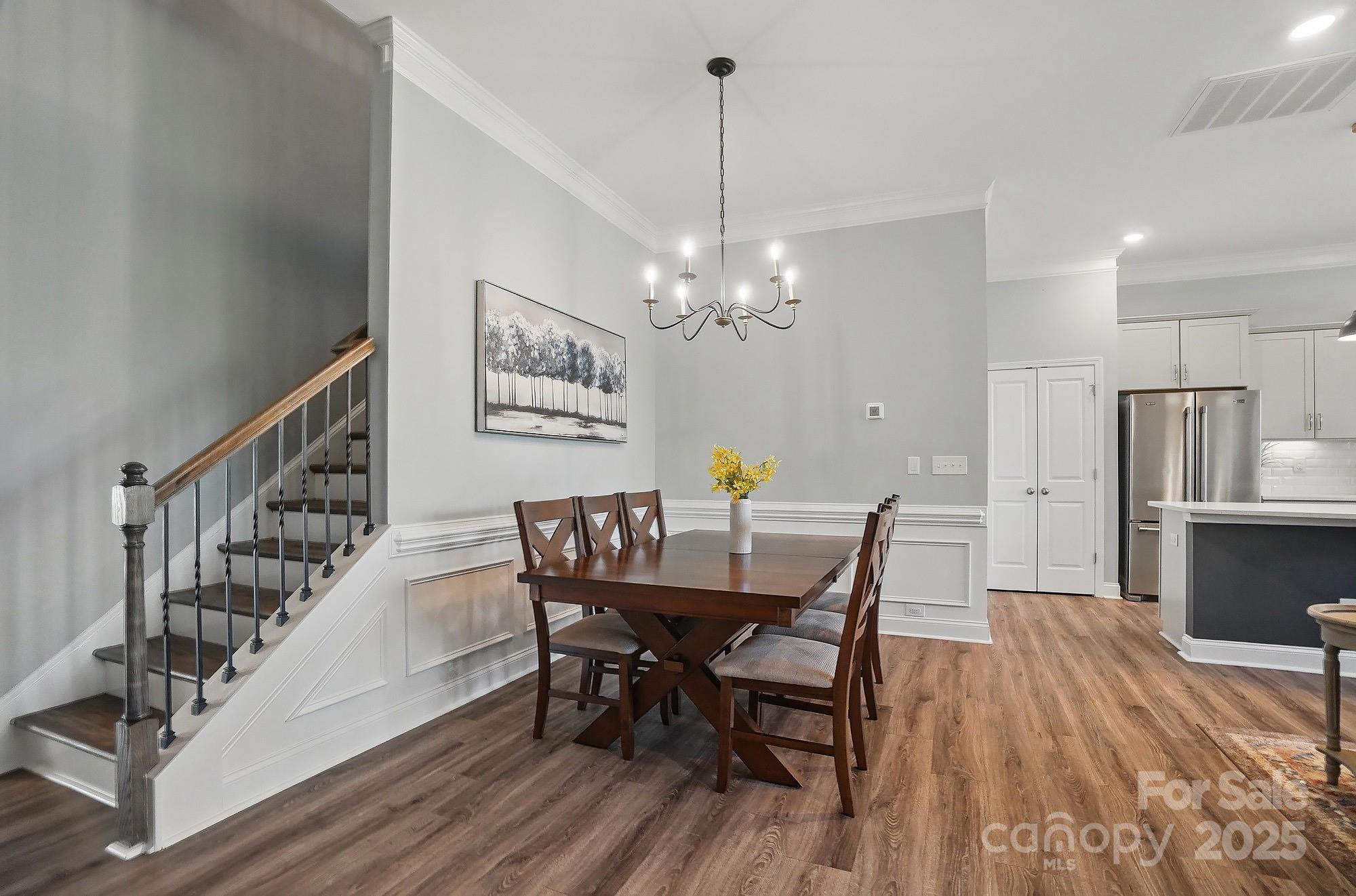 5004 Oakmere Road Waxhaw, NC 28173 - Photo 25 of 48 a view of a dining room with furniture and wooden floor