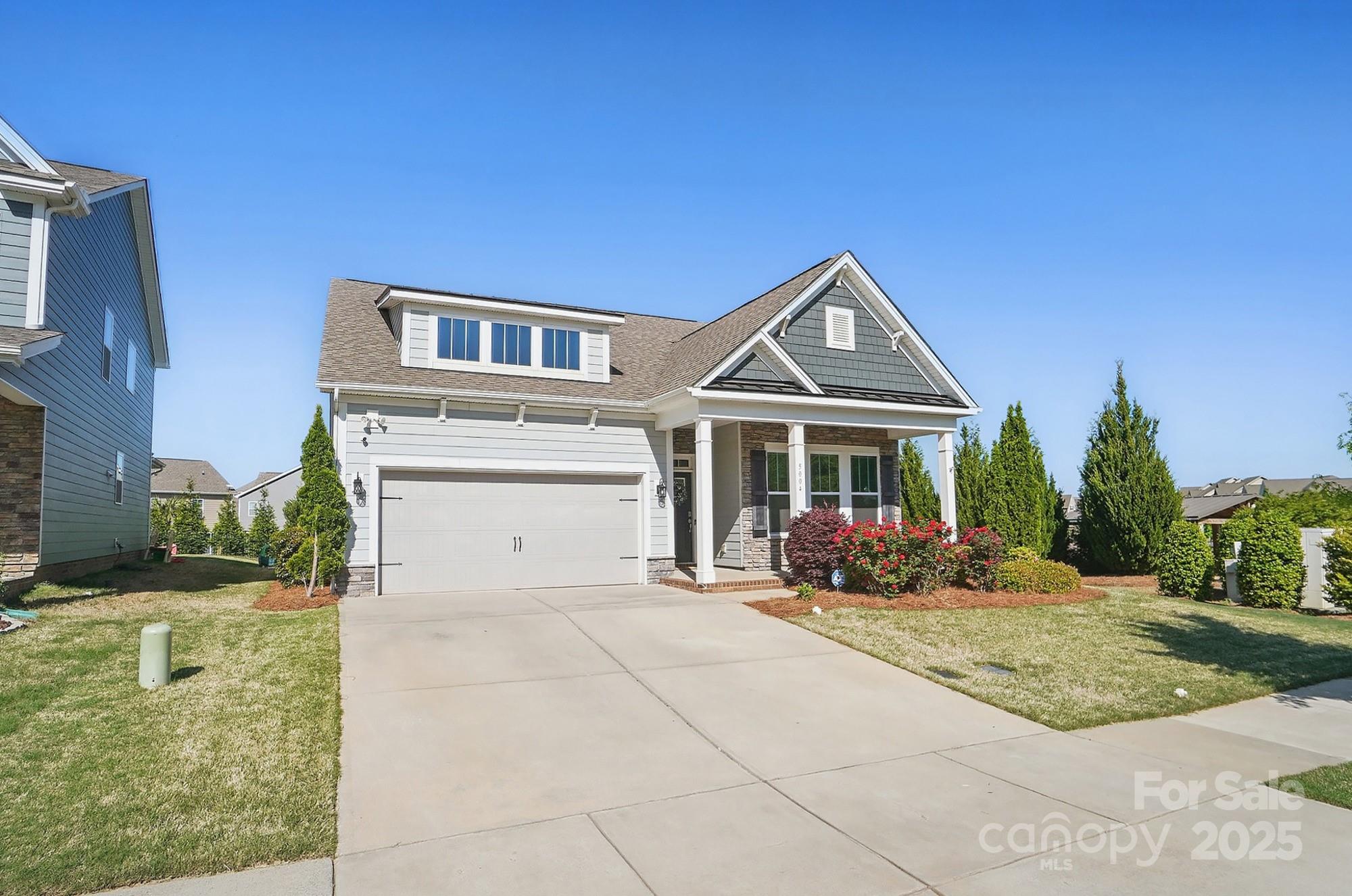 5004 Oakmere Road Waxhaw, NC 28173 - Photo 3 of 48 a front view of a house with garden