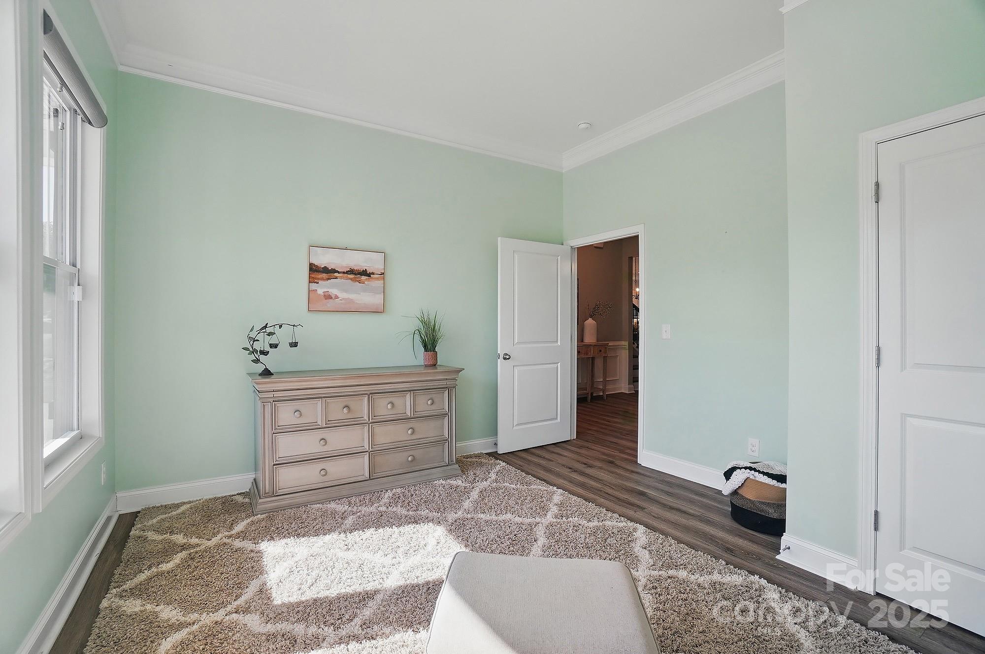 5004 Oakmere Road Waxhaw, NC 28173 - Photo 31 of 48 a bedroom with a bed and cabinets