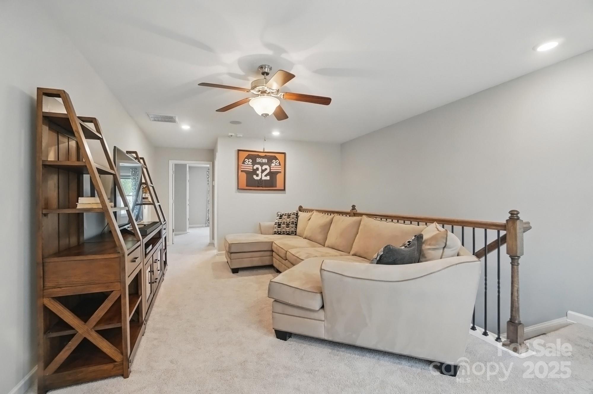 5004 Oakmere Road Waxhaw, NC 28173 - Photo 35 of 48 a living room with furniture and a chandelier