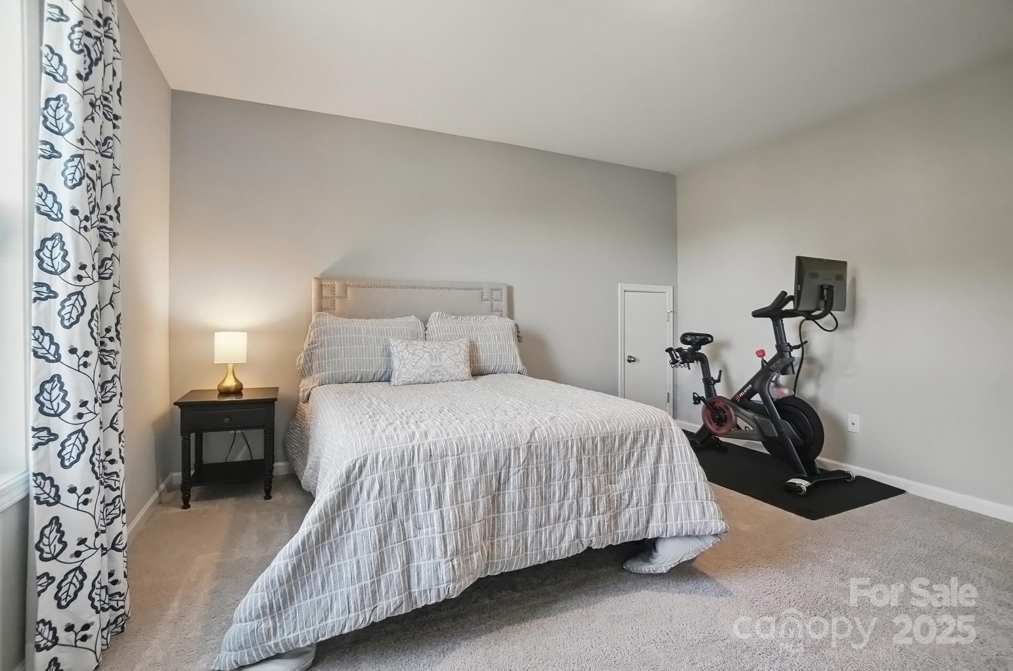 5004 Oakmere Road Waxhaw, NC 28173 - Photo 39 of 48 a bedroom with a bed and a chair