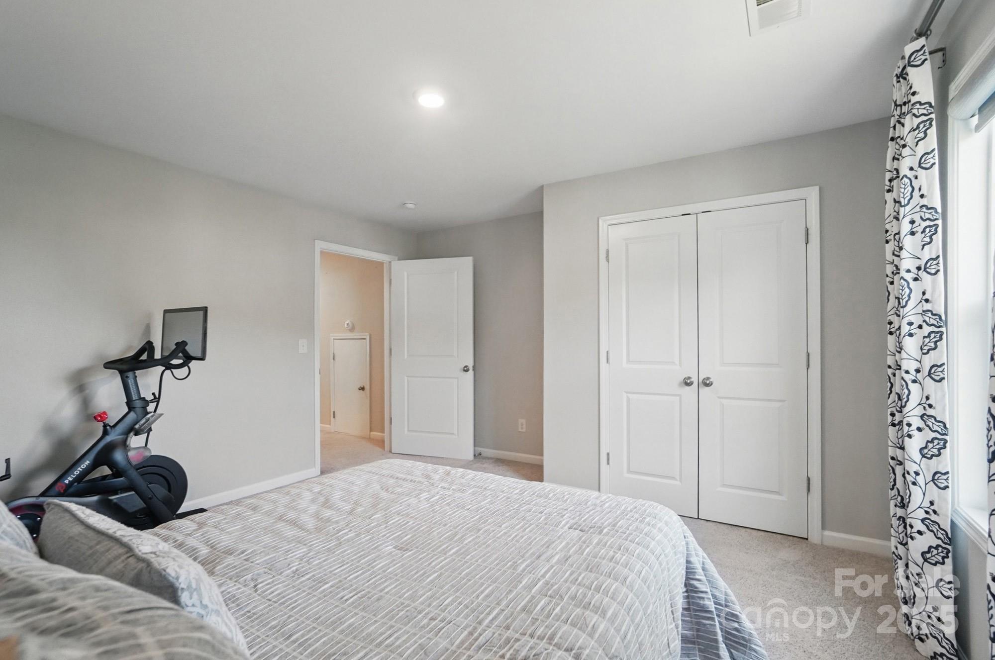 5004 Oakmere Road Waxhaw, NC 28173 - Photo 40 of 48 a bedroom with a bed and a window