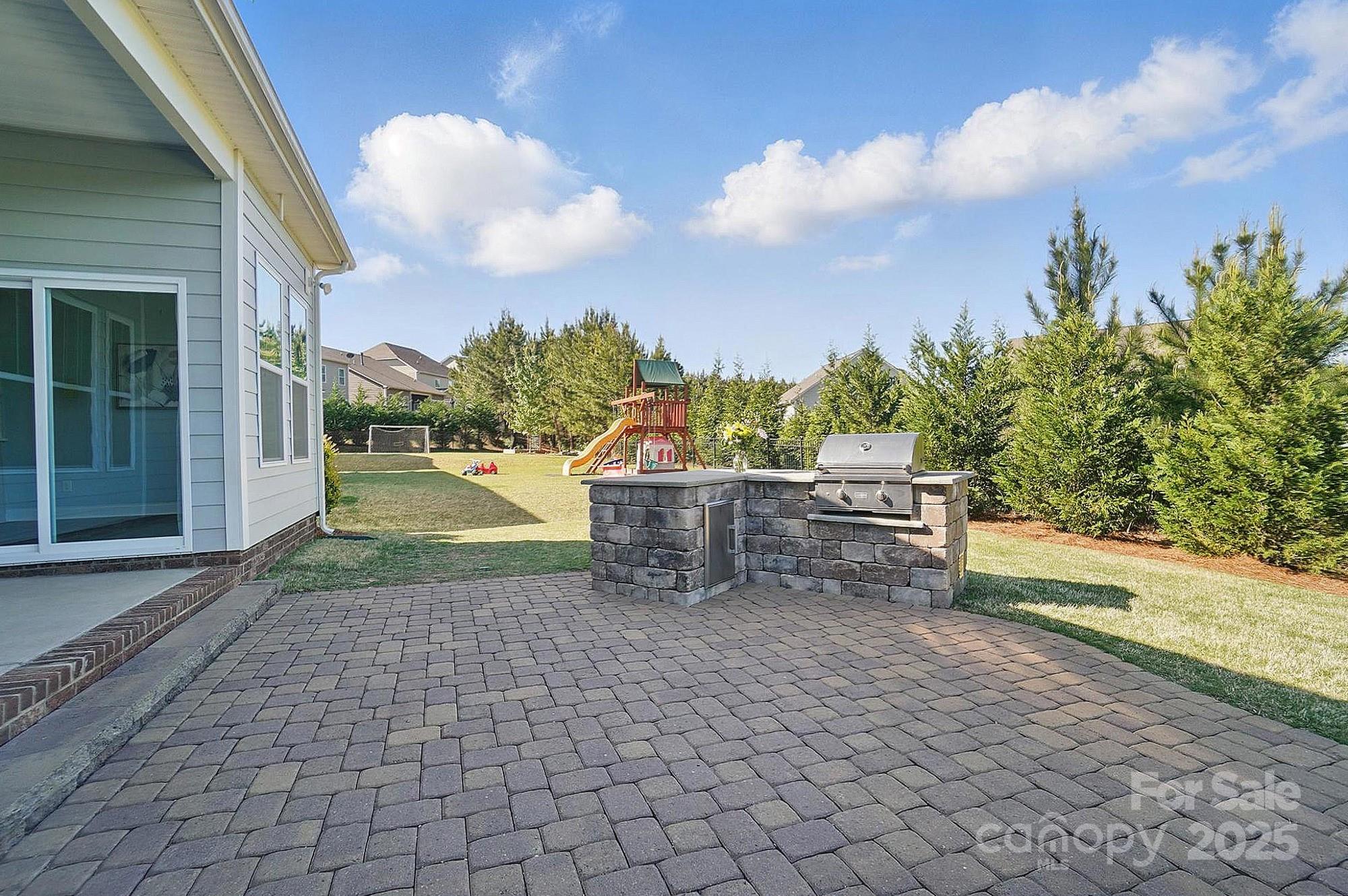 5004 Oakmere Road Waxhaw, NC 28173 - Photo 42 of 48 a view of a chairs and table on the terrace