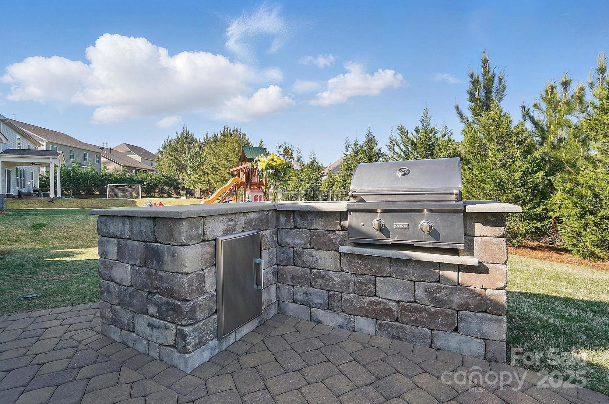 5004 Oakmere Road Waxhaw, NC 28173 - Photo 43 of 48 a view of a terrace with a garden