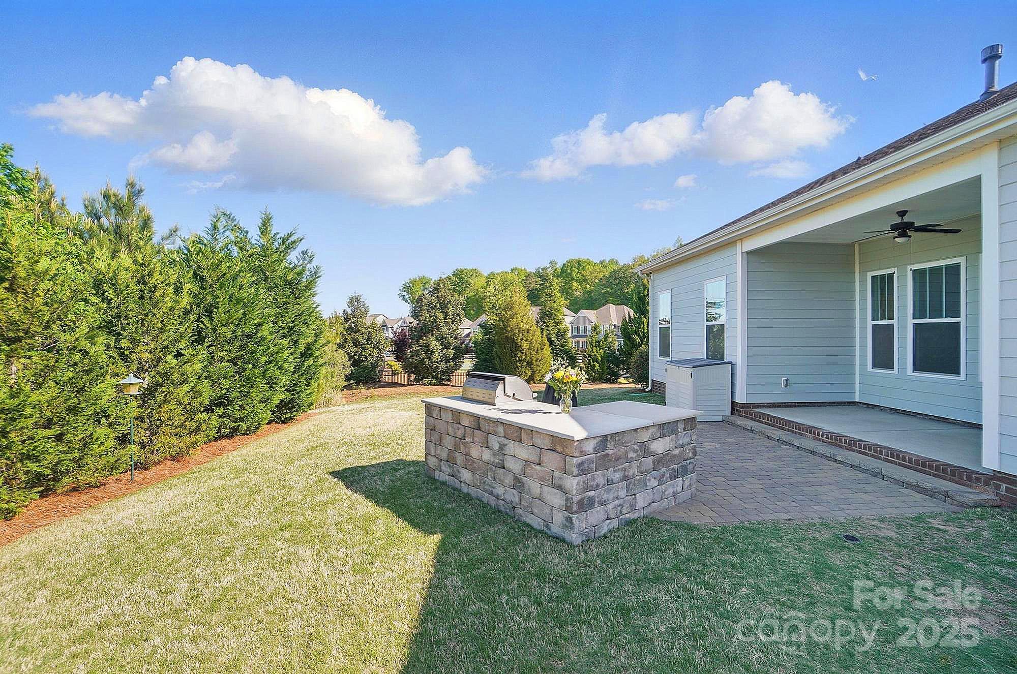 5004 Oakmere Road Waxhaw, NC 28173 - Photo 48 of 48 a view of a backyard with plants and a garden