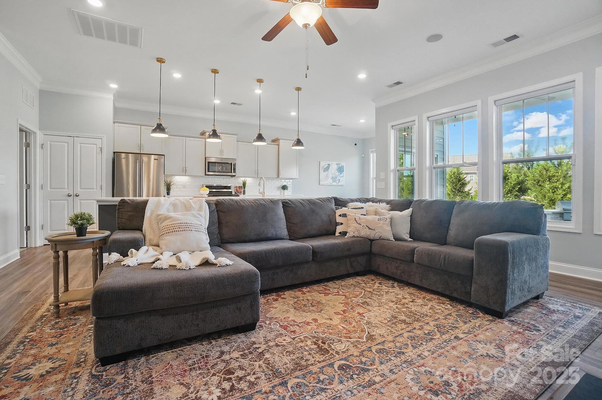 5004 Oakmere Road Waxhaw, NC 28173 - Photo 8 of 48 a living room with furniture and a large window