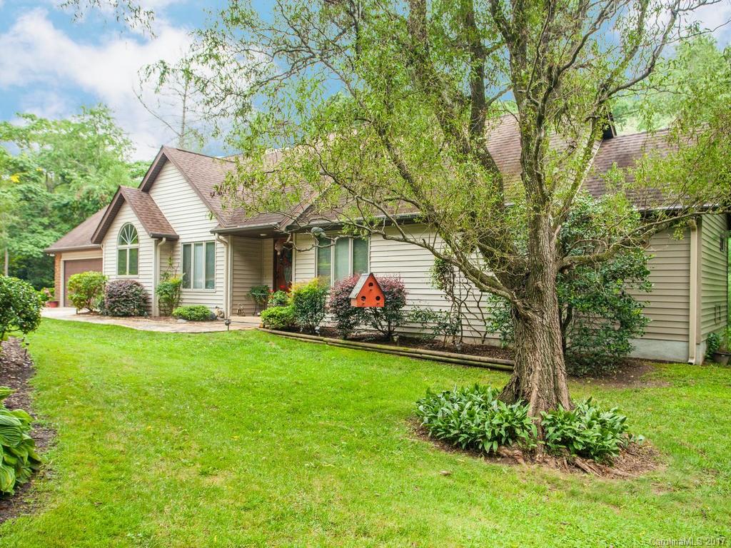 3419 Hebron Road Hendersonville, NC 28739 - Photo 1 of 22 a view of a house with a backyard