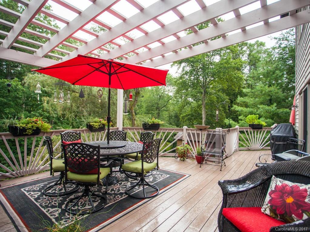 3419 Hebron Road Hendersonville, NC 28739 - Photo 13 of 22 a view of balcony with chairs and umbrella