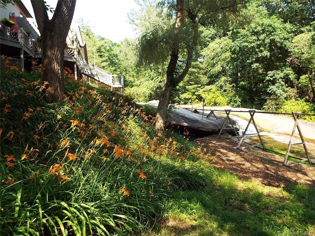 3419 Hebron Road Hendersonville, NC 28739 - Photo 21 of 22 a view of a house with a tree
