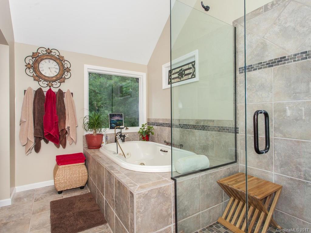 3419 Hebron Road Hendersonville, NC 28739 - Photo 9 of 22 a bathroom with a tub and shower