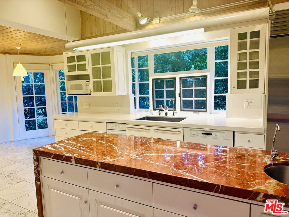 4031 Hollyline Avenue Sherman Oaks, CA 91423 - Photo 11 of 31 a living room with granite countertop and wide window