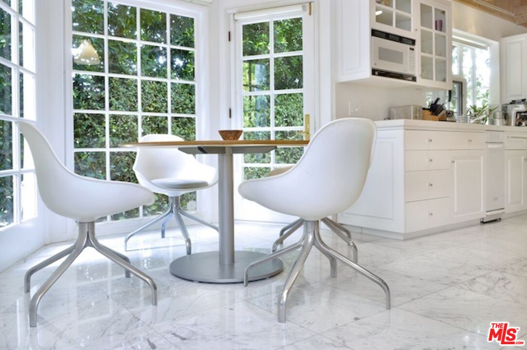 4031 Hollyline Avenue Sherman Oaks, CA 91423 - Photo 13 of 31 a view of a workspace room with furniture and a window