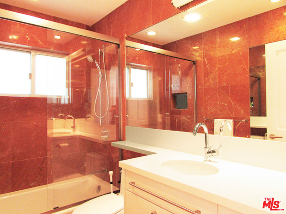 4031 Hollyline Avenue Sherman Oaks, CA 91423 - Photo 17 of 31 a bathroom with a sink and a bathtub