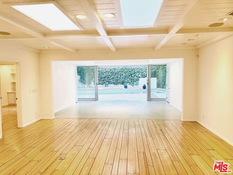 4031 Hollyline Avenue Sherman Oaks, CA 91423 - Photo 5 of 31 a view of a room with wooden floor