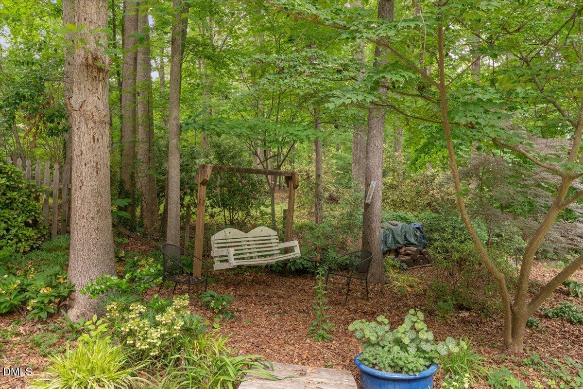 109 Hemingway Forest Place Raleigh, NC 27607 - Photo 23 of 33 a outdoor view of a garden