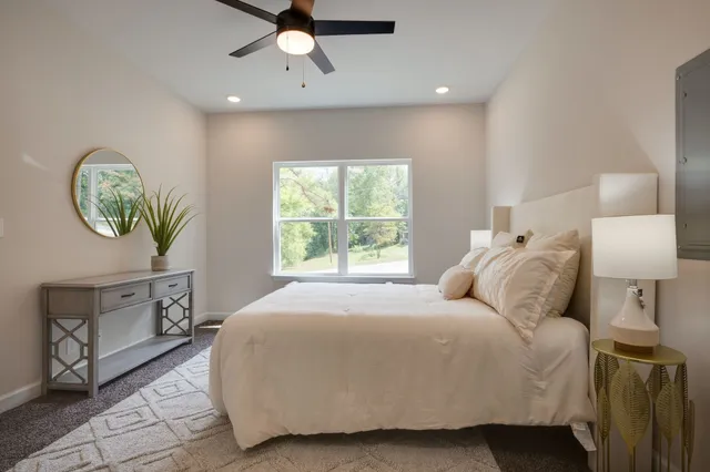 a bedroom with a bed and a window