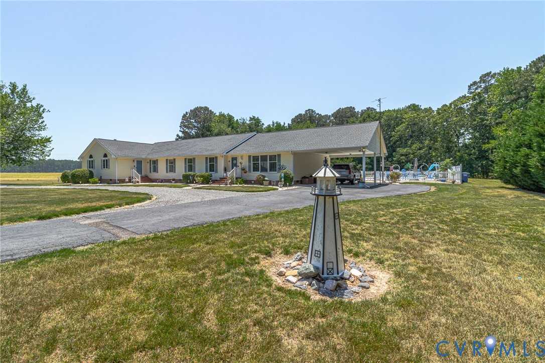 4400 Hacks Neck Road Heathsville, VA 22473 - Photo 75 of 78 a front view of a house with a yard