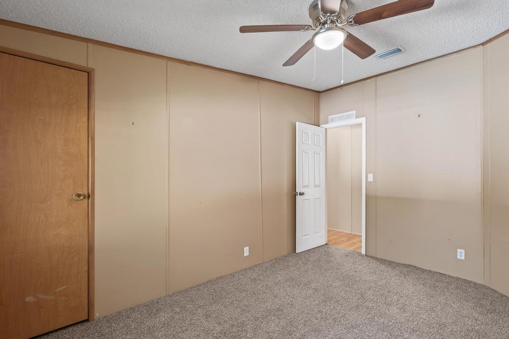 2744 Roy Sikes Road Hilliard, FL 32046 - Photo 40 of 97 a view of an empty room and chandelier fan