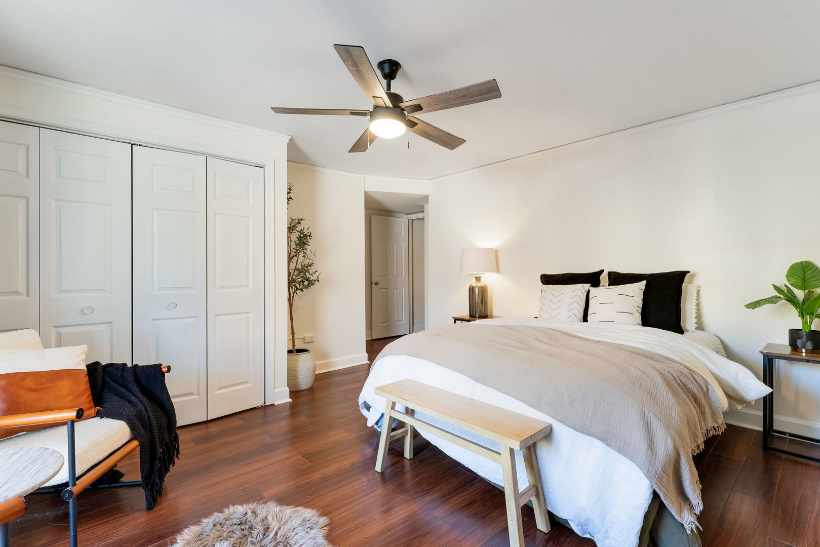 5543 West Higgins Avenue, Unit 1 Chicago, IL 60630 - Photo 11 of 21 a bedroom with a bed and wooden floor