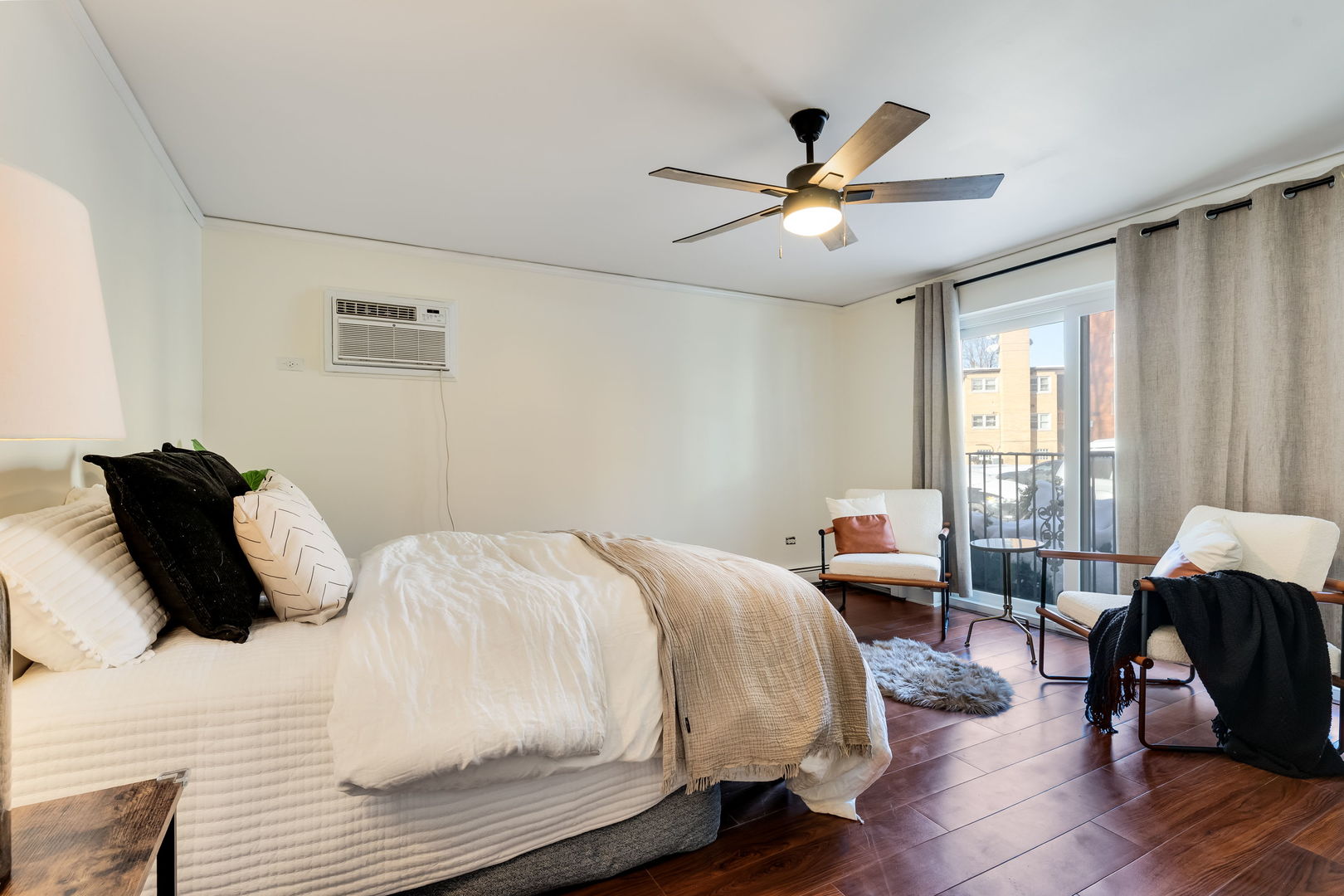 5543 West Higgins Avenue, Unit 1 Chicago, IL 60630 - Photo 12 of 21 a bedroom with a bed and wooden floor