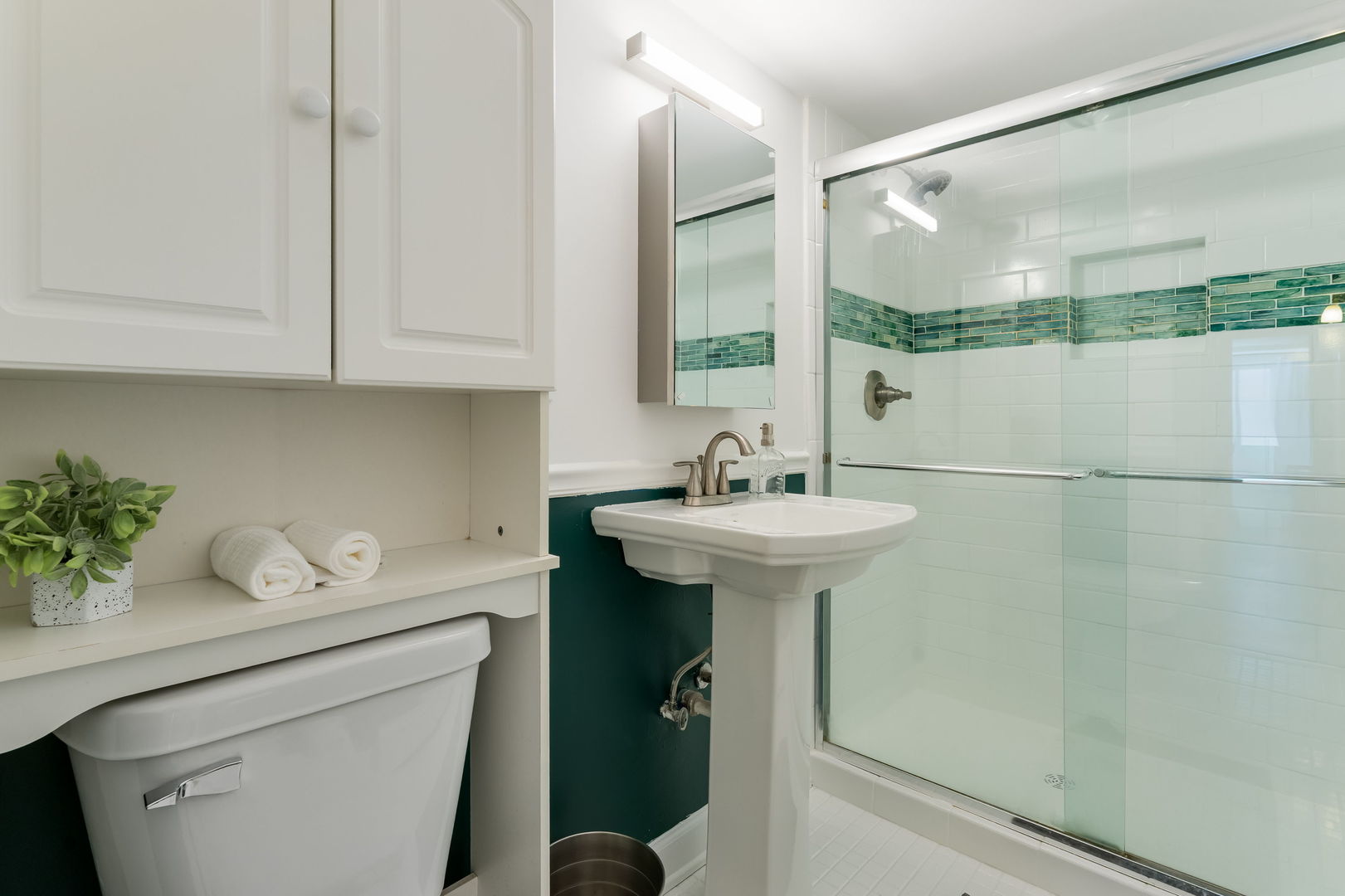 5543 West Higgins Avenue, Unit 1 Chicago, IL 60630 - Photo 14 of 21 a bathroom with a sink toilet and shower