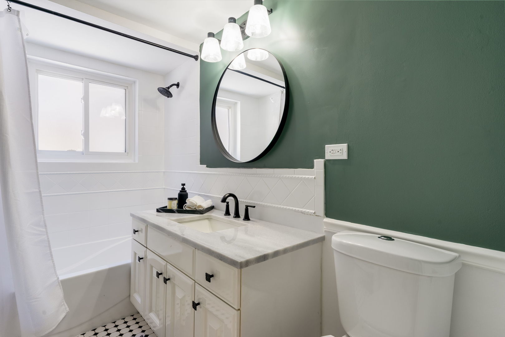 5543 West Higgins Avenue, Unit 1 Chicago, IL 60630 - Photo 18 of 21 a bathroom with a sink a vanity and a mirror