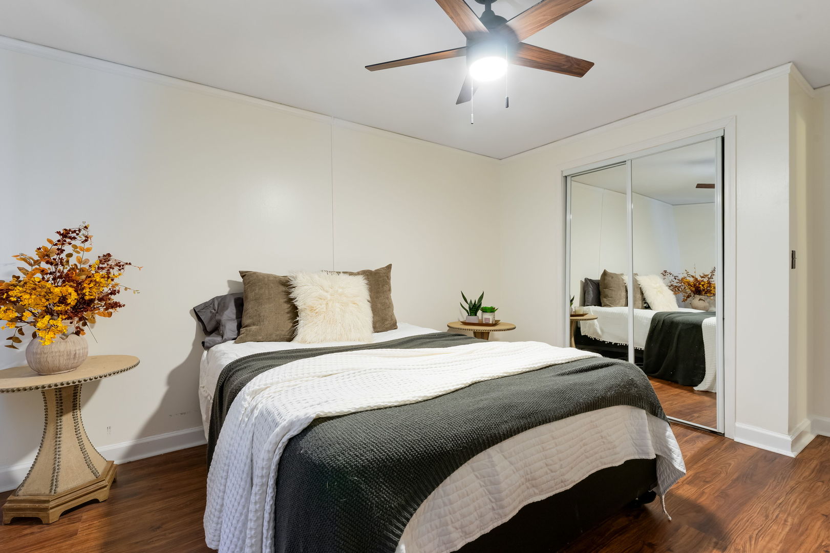 5543 West Higgins Avenue, Unit 1 Chicago, IL 60630 - Photo 19 of 21 a bedroom with bed and a chandelier