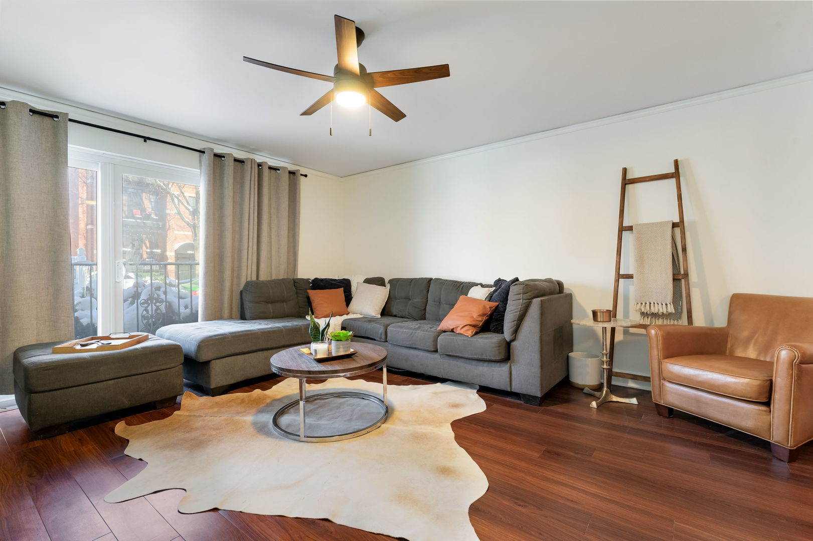 5543 West Higgins Avenue, Unit 1 Chicago, IL 60630 - Photo 4 of 21 a living room with furniture and a large window